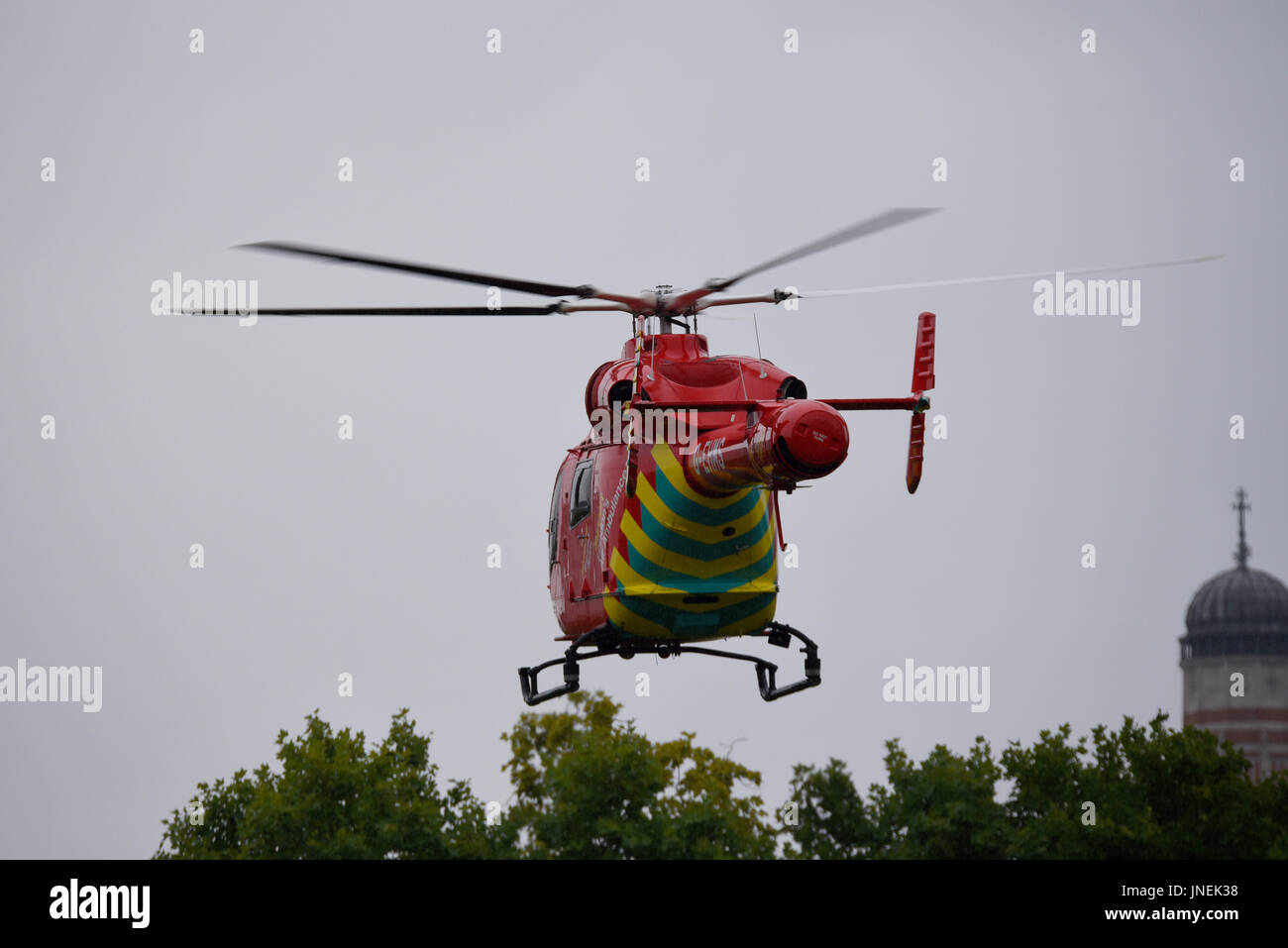 London's Air Ambulance G-EHMS landed on the green space between Birdcage Walk and Buckingham Palace in response to an incident at Victoria Station Stock Photo