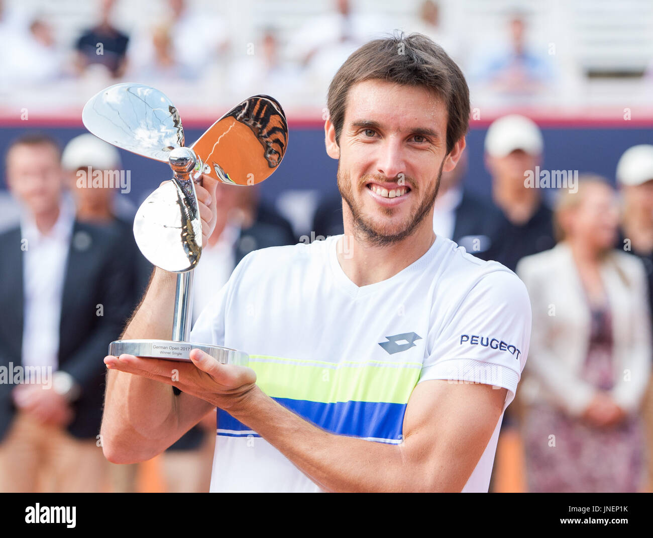 Hamburg, Germany. 30th July, 2017. Leonardo Mayer of Argentina celebrates  his victory over Mayer of Germany with his trophy in the men's singles  final of the Tennis ATP-Tour German Open in Hamburg,