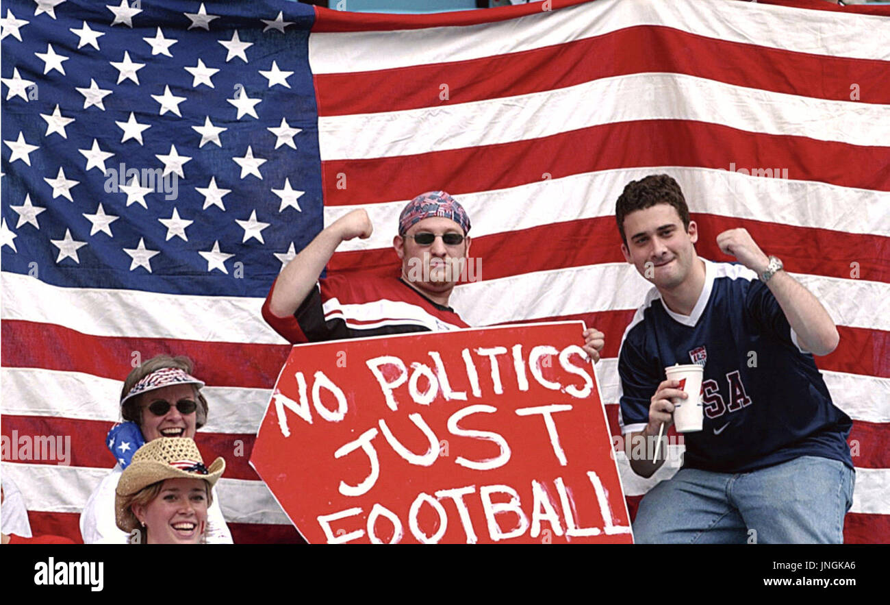 TAEGU, June 10 - U.S. supporters pose with a sign board reading ''No POLITICS JUST FOOTBALL'' at the Taegu World Cup Stadium on June 10 before the start of a group D match in the World Cup finals between South Korea-the U.S. (World Cup 2002) Stock Photo