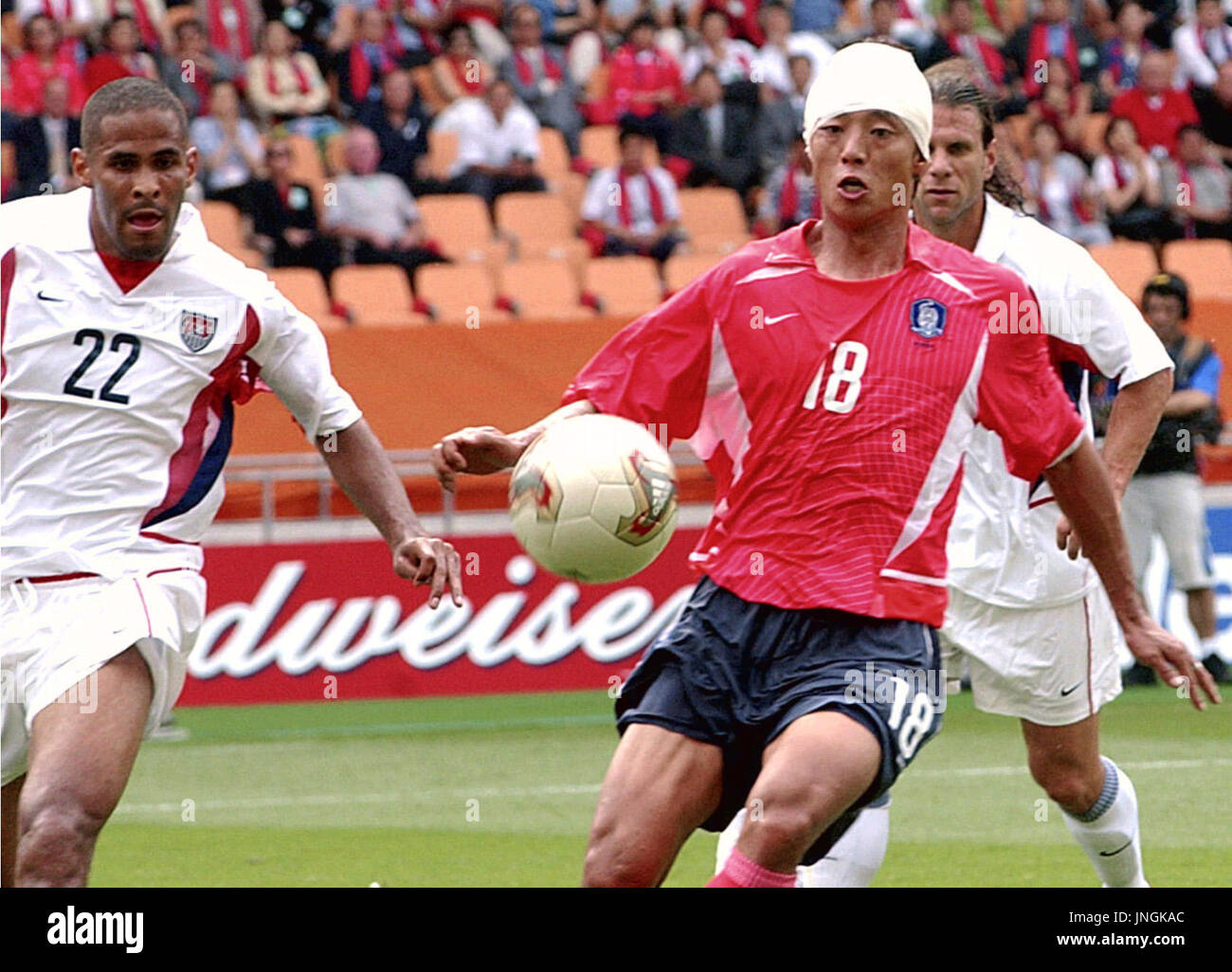 TAEGU, South Korea - South Korea's Hwang Sun Hong (18), wearing a bandage, chases the ball during the first half of a group D match of the World Cup finals at Taegu World Cup Stadium on June 10.(World Cup 2002) Stock Photo