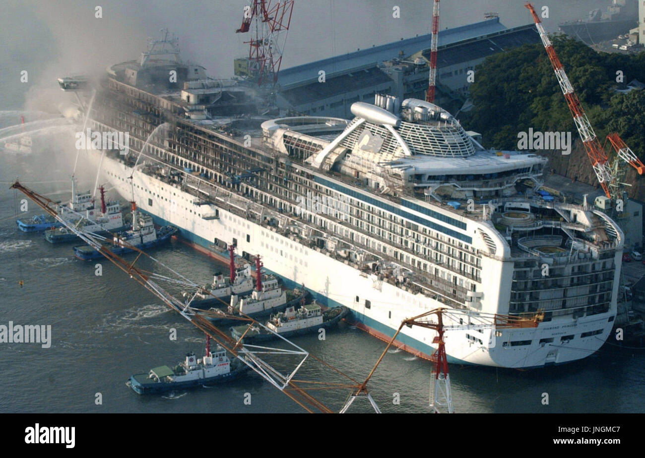 NAGASAKI, Japan - Photo taken Oct. 2 shows the 113,000-ton Diamond Princess damaged by fire while under construction at the Nagasaki shipyard of Mitsubishi Heavy Industries Ltd. Mitsubishi said Oct. 10 it and P&O Princess Cruises PLC, a major international cruise company based in Britain, have agreed to continue construction on the ship. (Kyodo) Stock Photo