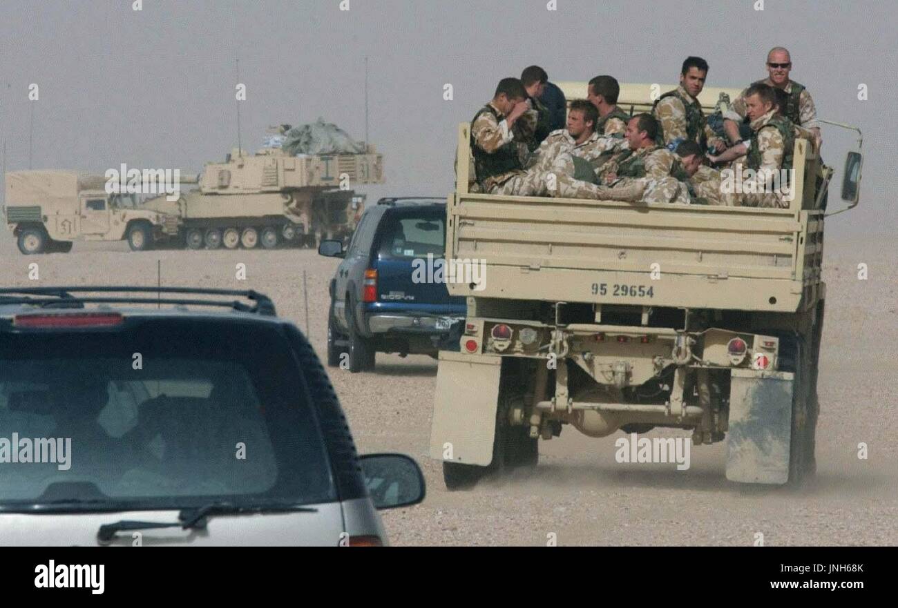 KUWAIT Trucks carrying British soldiers move in a Kuwaiti desert on