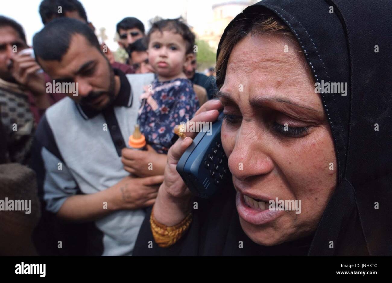 BAGHDAD, Iraq An Iraqi woman asks after her family's safety over a