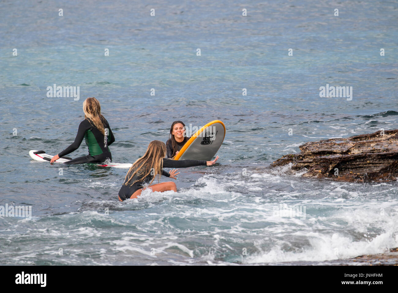 Women surfing hi-res stock photography and images - Alamy