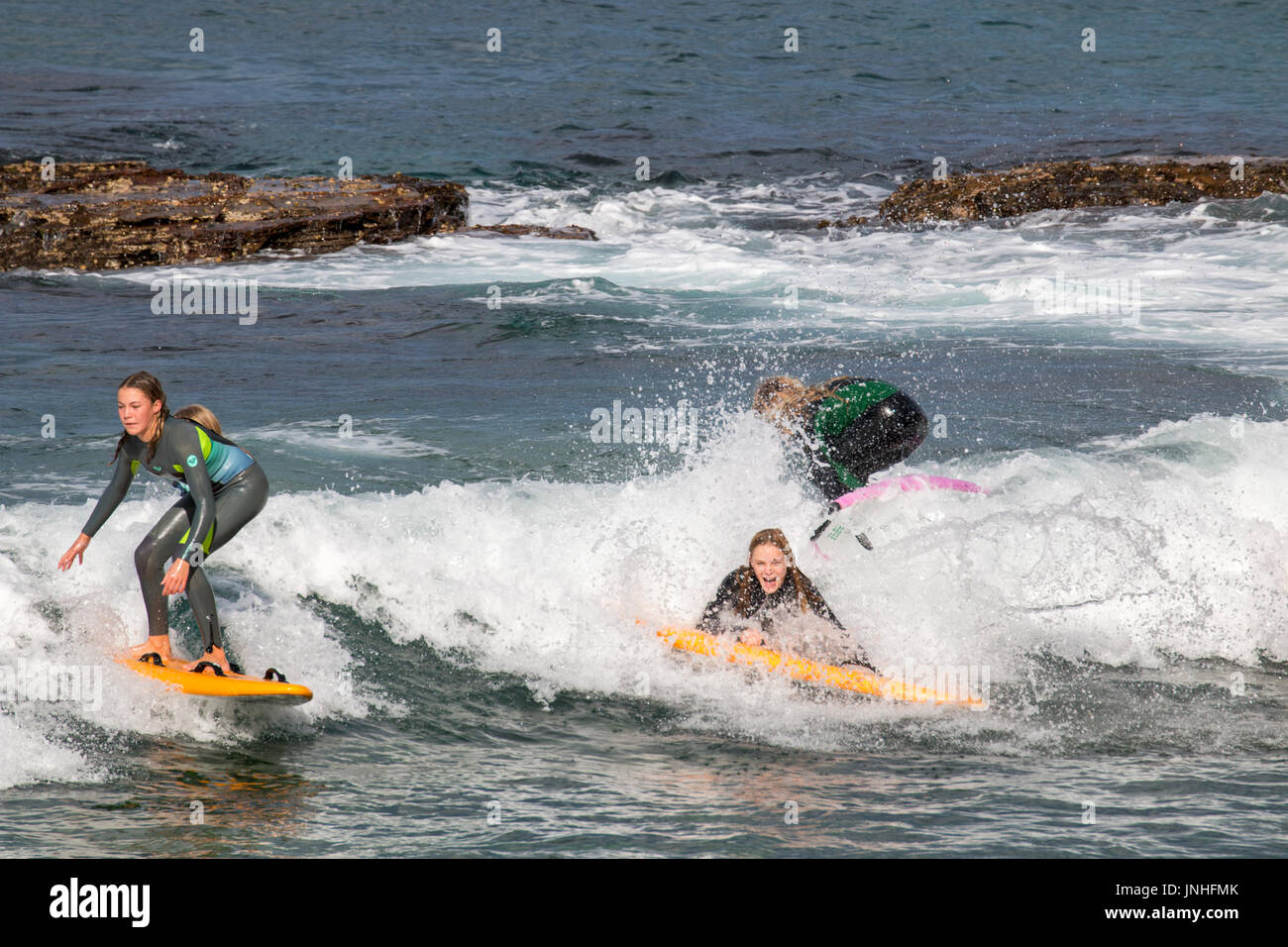Women surfing hi-res stock photography and images - Alamy