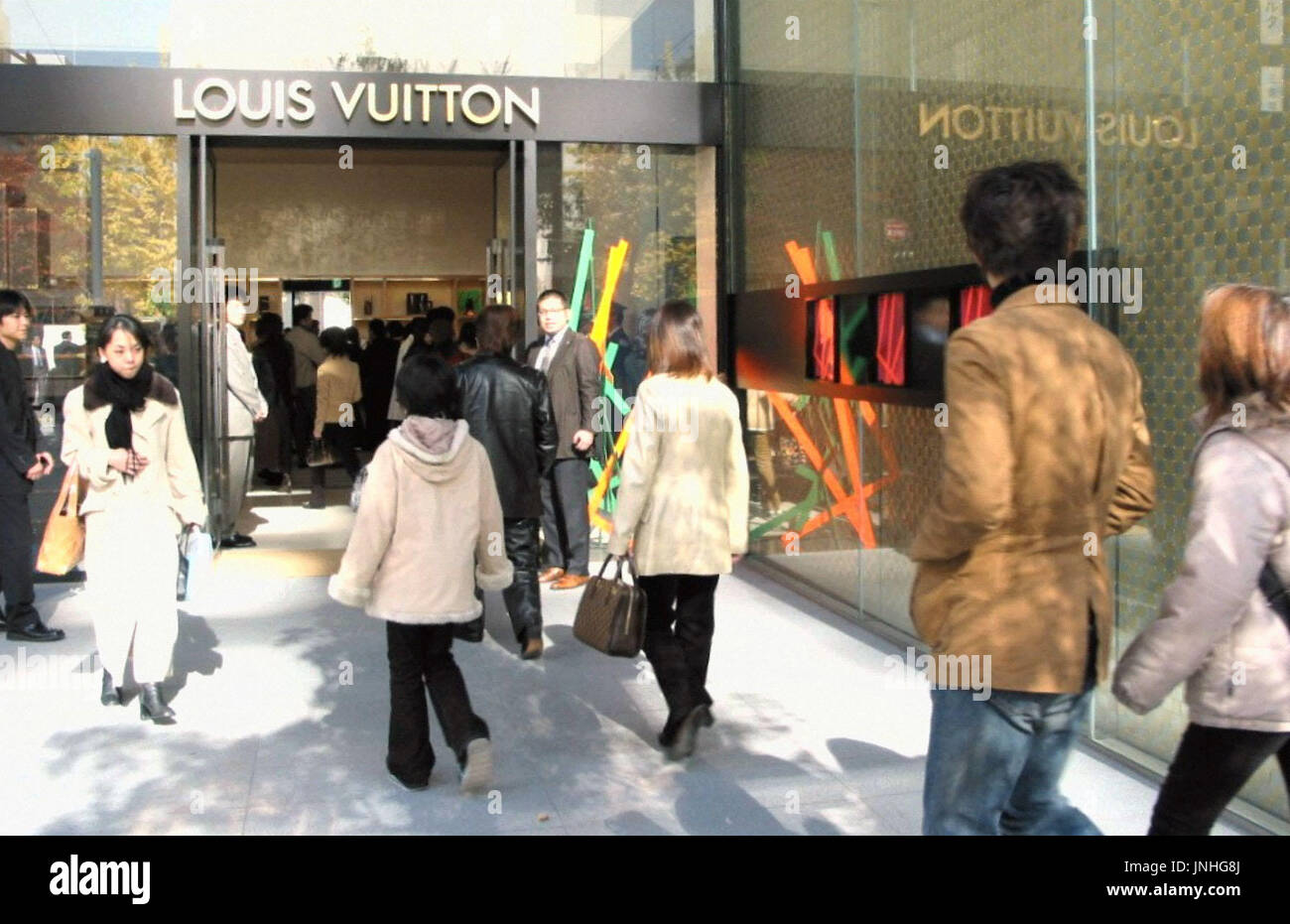 KOBE, Japan - Shoppers crowd the Louis Vuitton store in Kobe, the ...