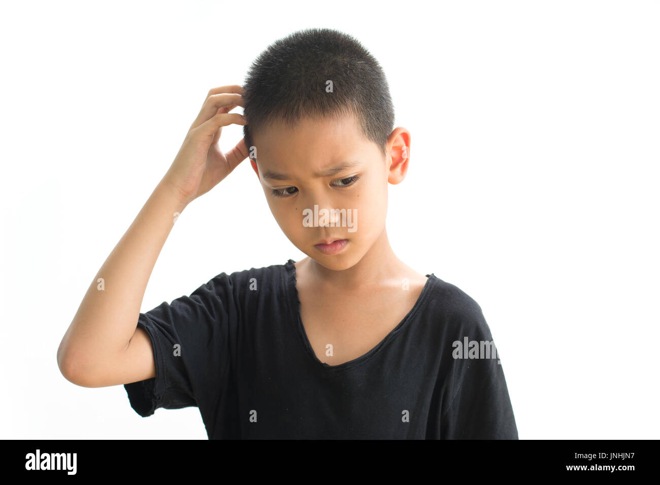 Boy scratching head hi-res stock photography and images - Alamy