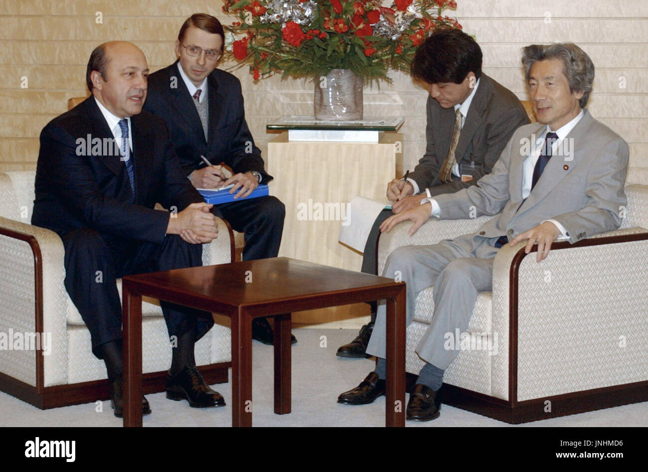 TOKYO, Japan - Japanese Prime Minister Junichiro Koizumi (R) holds ...