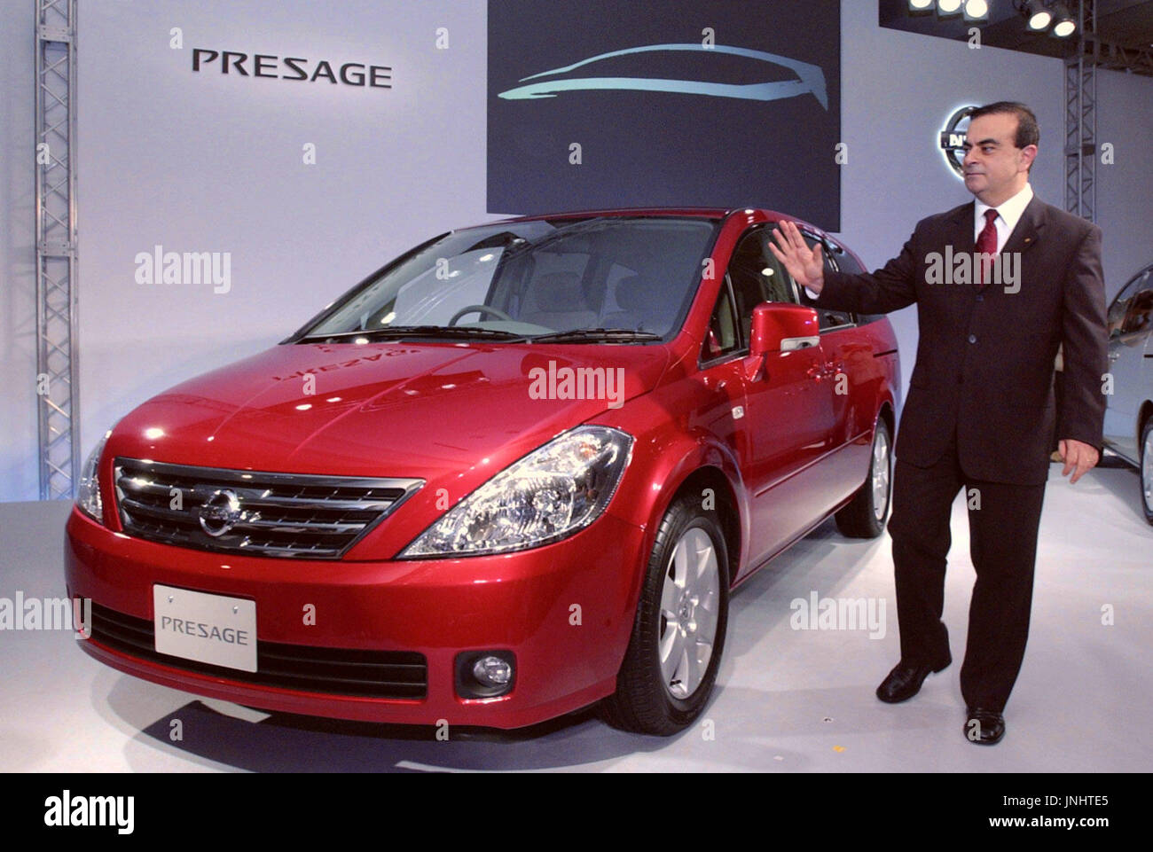 TOKYO, Japan - Nissan Motor Co. President Carlos Ghosn poses with a ...