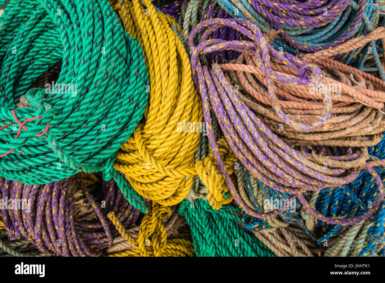 Colorful sink, hydropro and float ropes used for lobster traps piled up ...