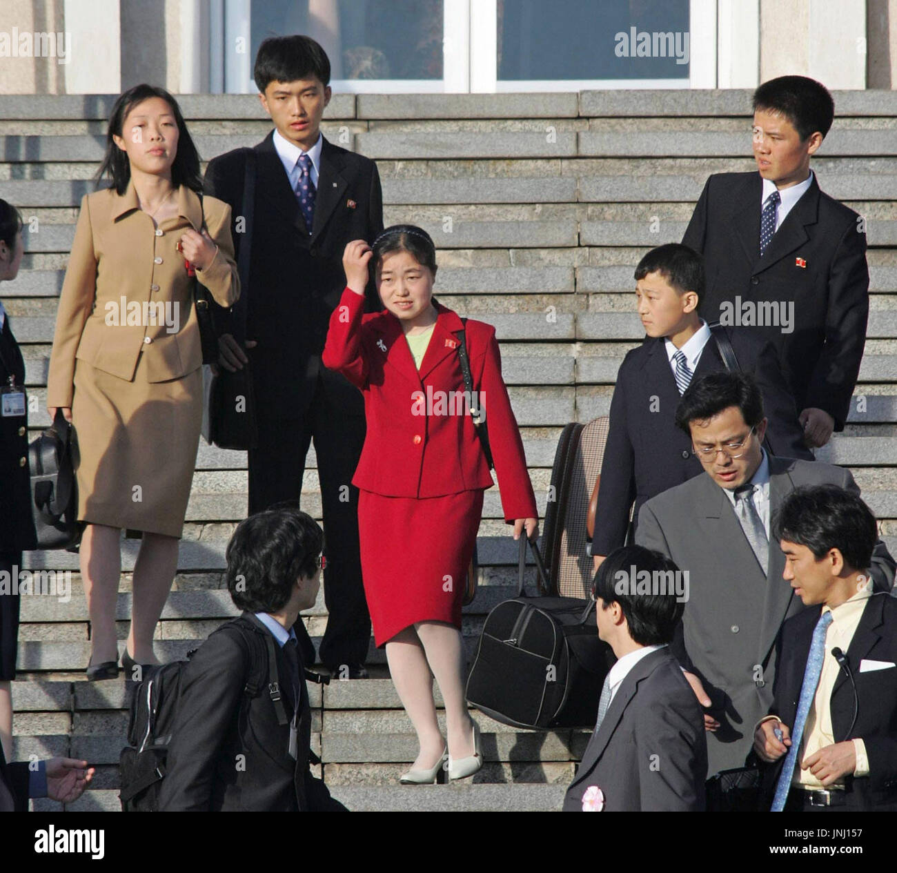 PYONGYANG, North Korea - The sons and daughters of former Japanese  abductees Yasushi Chimura and his wife Fukie, and Kaoru Hasuike and his wife  Yukiko, prepare to board a Japanese government plane