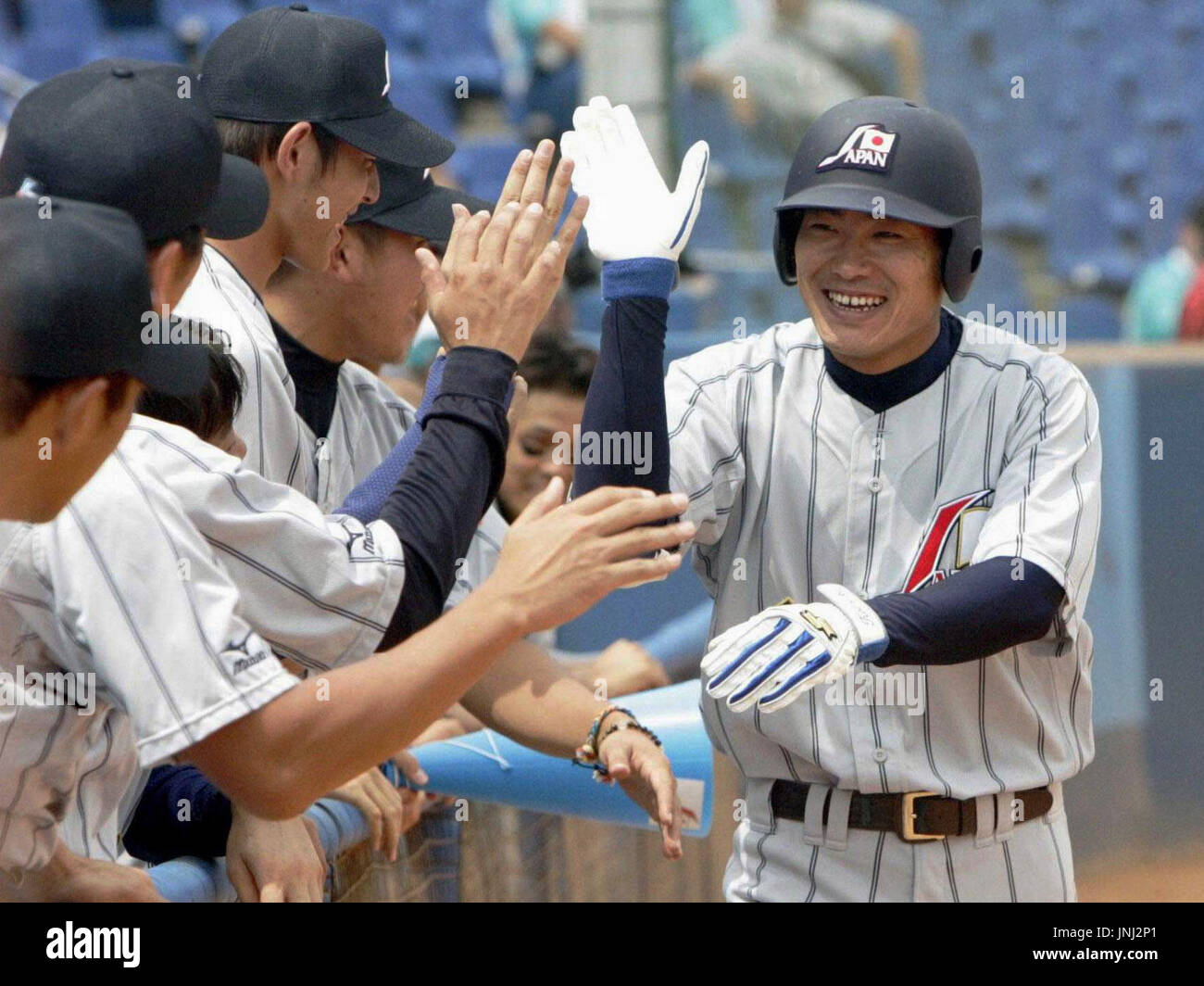 ATHENS, Greece - Japan’s Kosuke Fukudome gets congratulations from