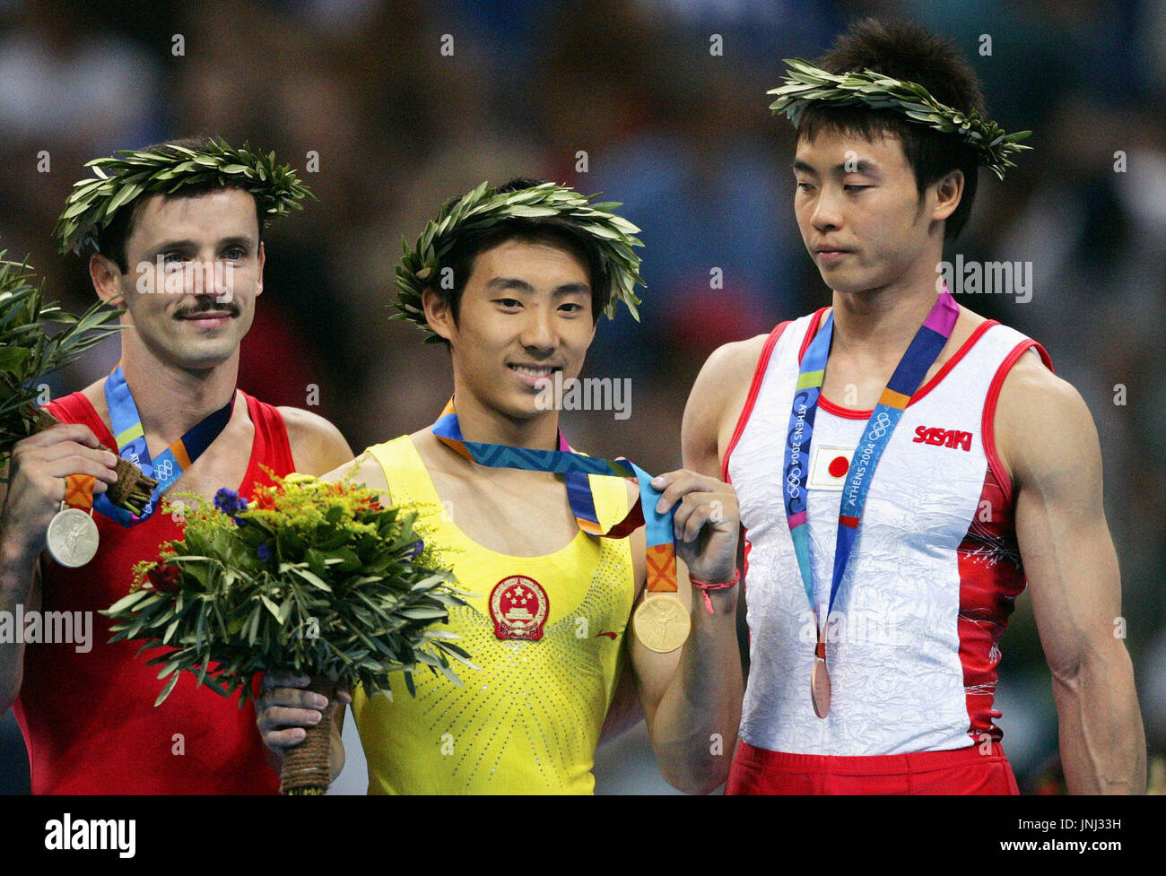 ATHENS, Greece Pommel horse gold medalist Teng Haibin of China (C