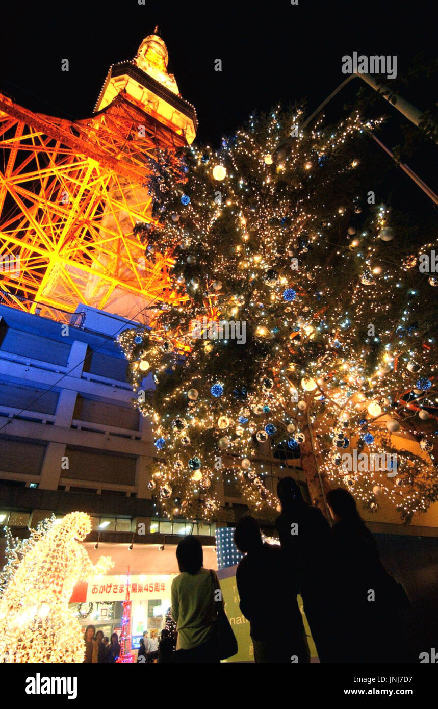 TOKYO, Japan - A Christmas tree's lights are switched on in front of ...
