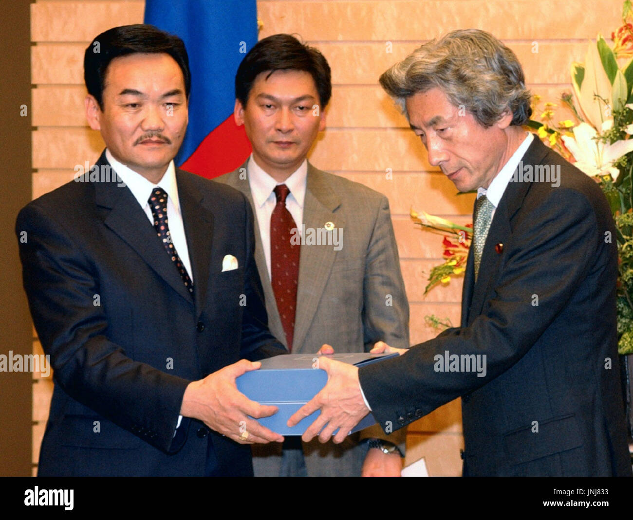 Tokyo Japan Visiting Mongolian President Nachagyn Bagabandy L Hands Prime Minister Junichiro Koizumi A List Containing Information About 110 Japanese Detained In Mongolia After World War Ii At The Prime Minister S