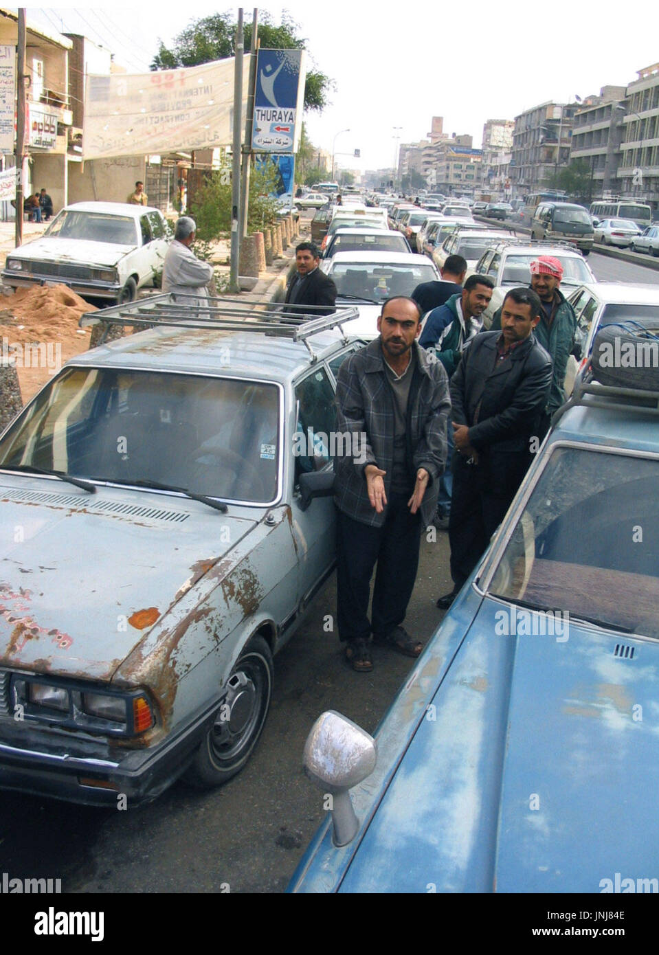 BAGHDAD, Iraq A long line of cars wait at a Baghdad gas station Dec