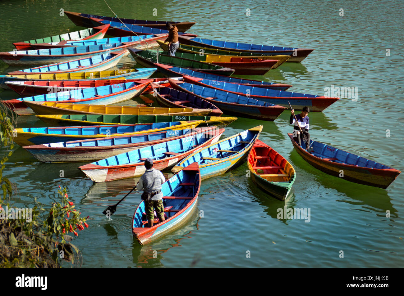 colorful canoes waiting for tourist in Fewa Lake, Pokharra Nepal Stock Photo