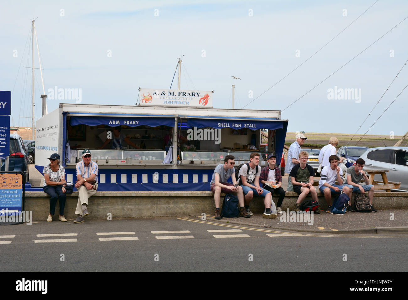 A & M Frary Shell Fish Stall and customers at Wells-next-the-sea Norfolk Engalnd Stock Photo
