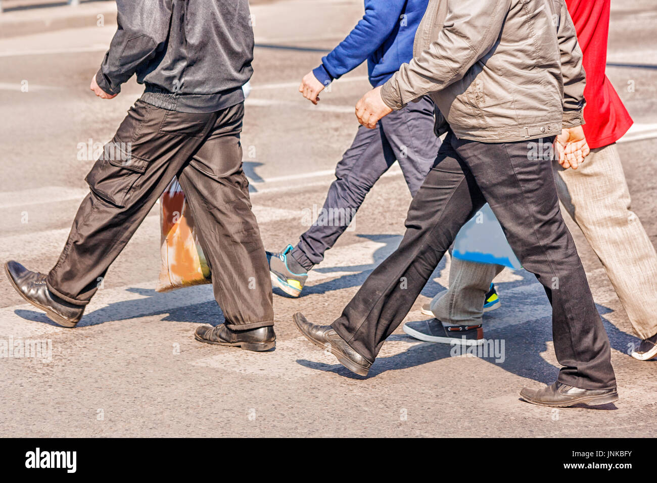 pedestrians walking on the pedestriant crossing on summer day Stock ...