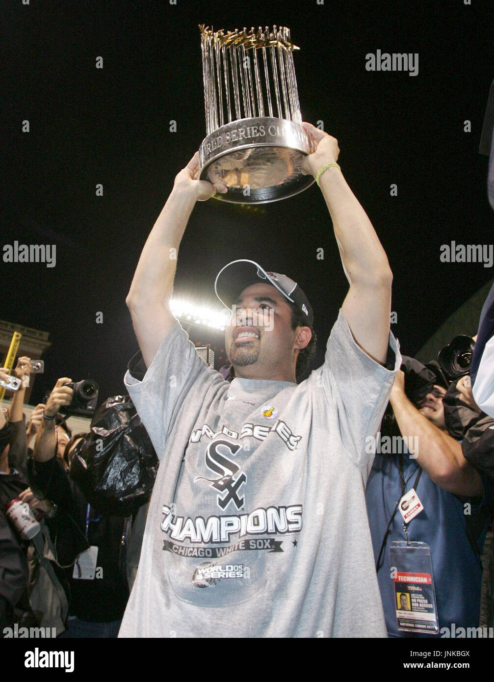 Chicago White Sox manager Ozzie Guillen hoists the World Series trophy  after beating the Houston Astros 1-0 in game 4 of the World Series, October  26, 2005 in Houston, TX. The White