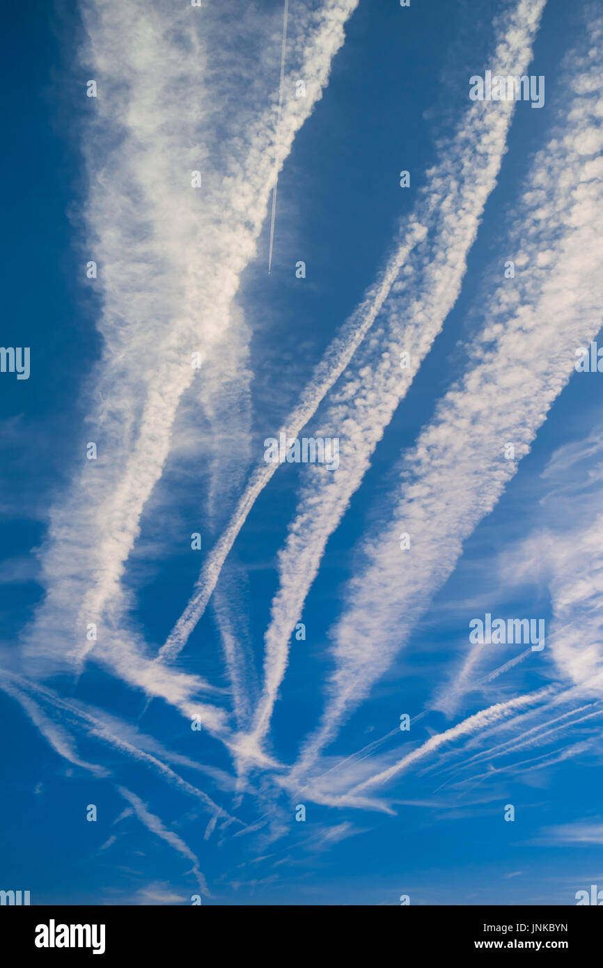 Contrails / chemtrails in blus sky - central France. Stock Photo