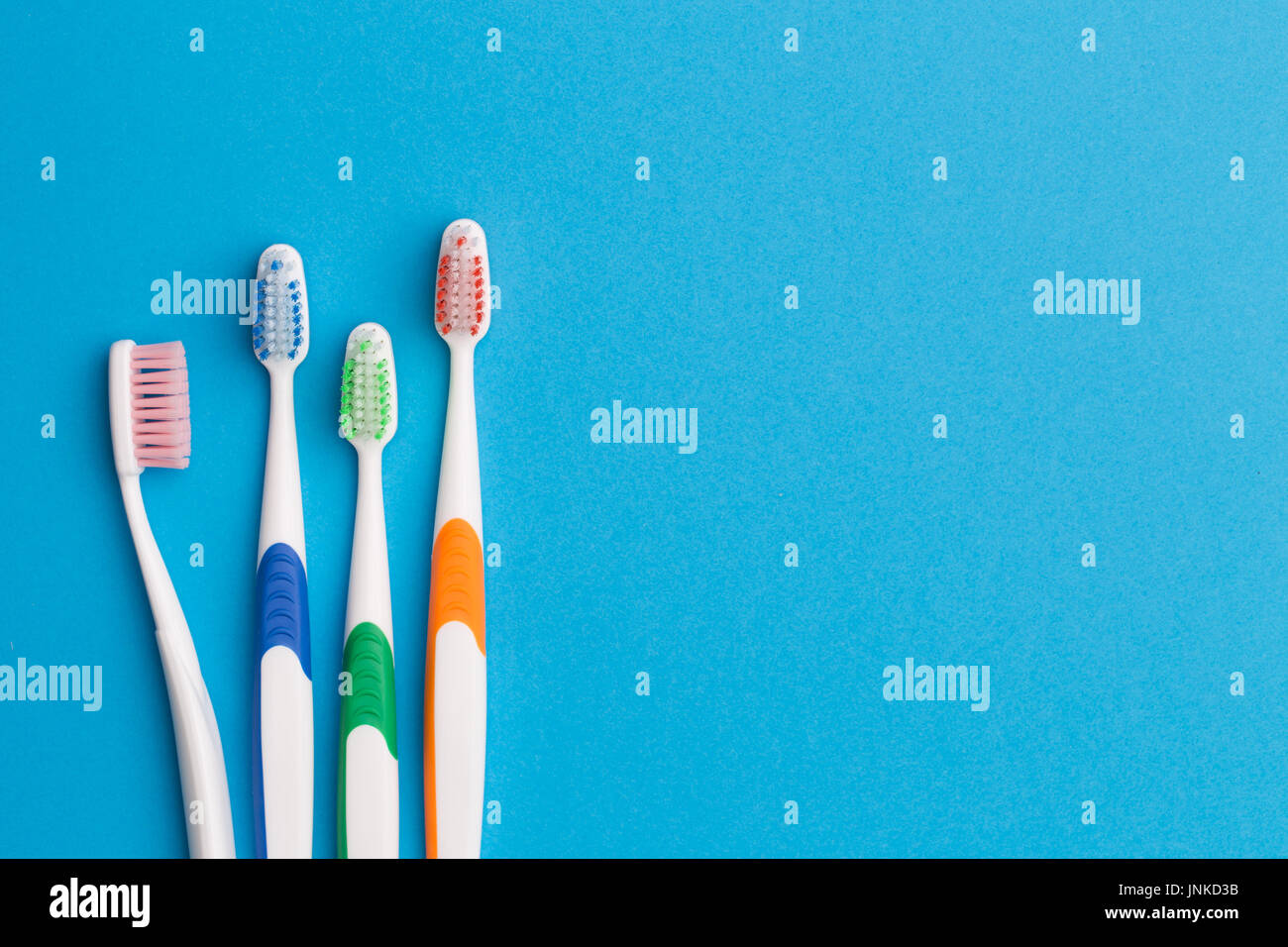 Colorful toothbrushes, space for text Stock Photo