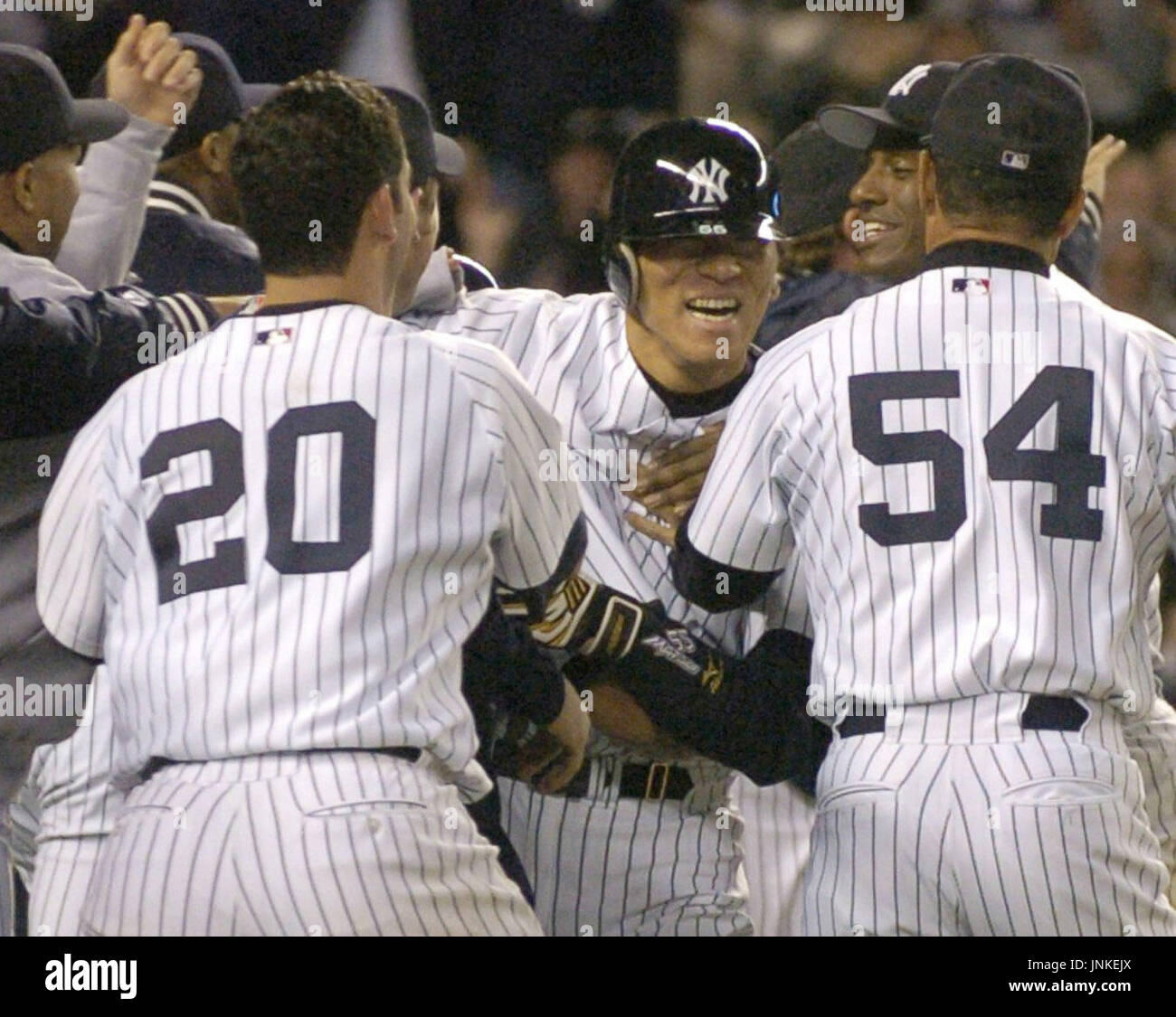 NEW YORK, United States - Hideki Matsui (C) gets congratulations from ...