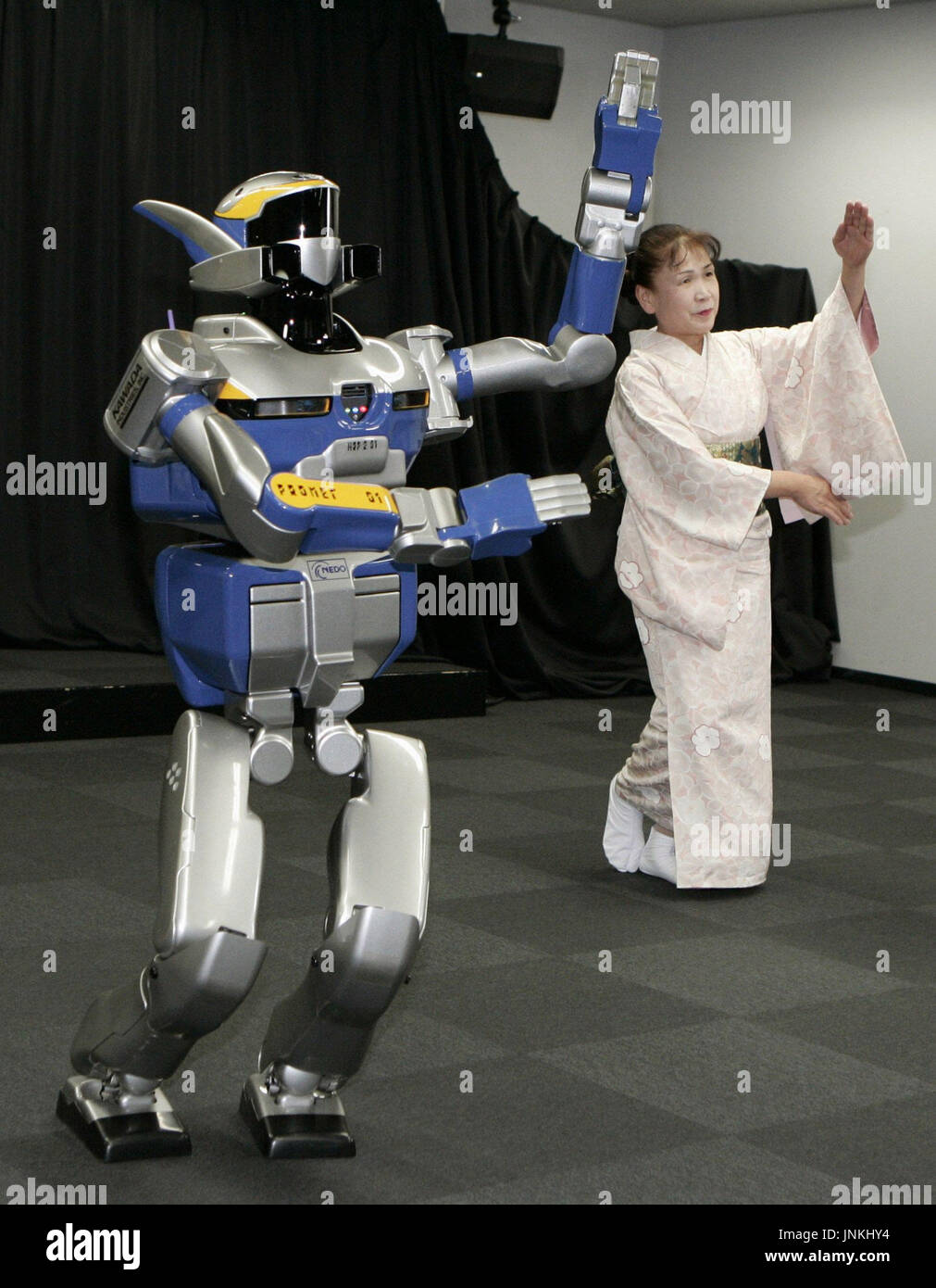 TOKYO, Japan - A humanoid robot, developed by the University of Tokyo and  the National Institute of Advanced Industrial Science and Technology,  performs a traditional Japanese dance with a dance instructor in