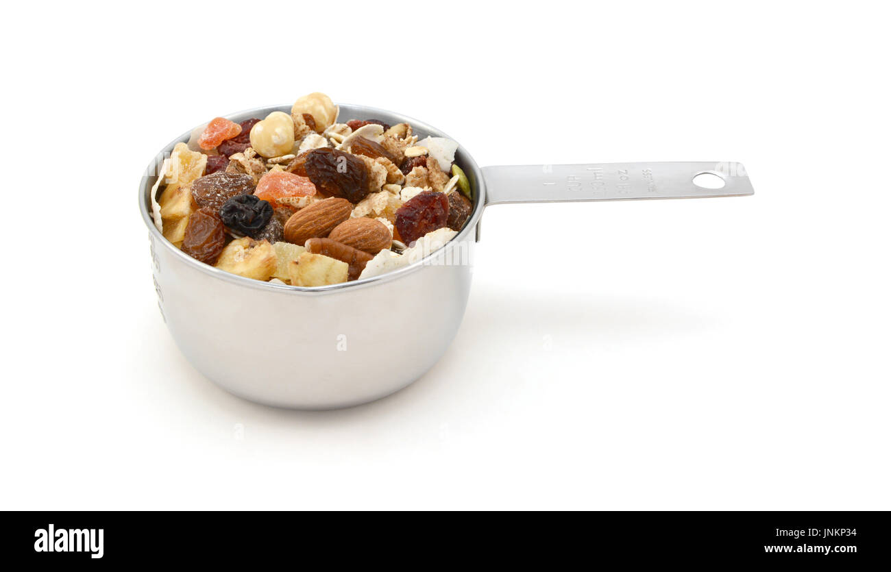 Muesli cereal flakes with seeds, mixed fruit and nuts in an