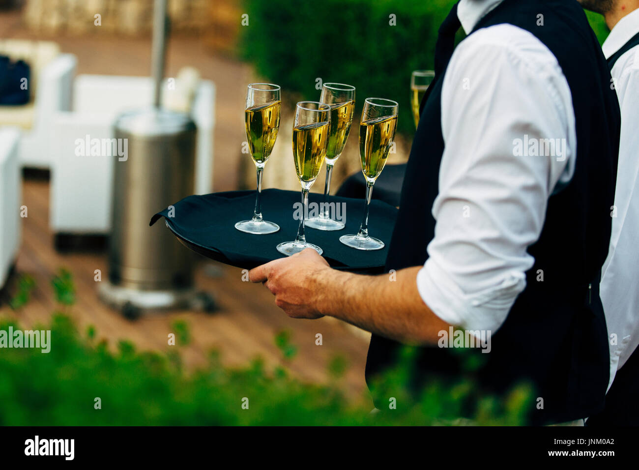 Waiter serving wine glasses. Red, White and Champagne glasses at social