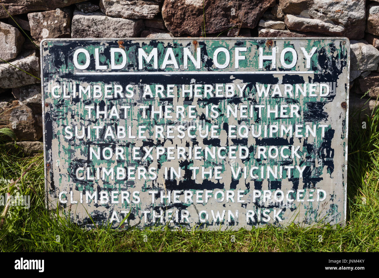 Sign stating that climbers on The Old Man of Hoy are at risk with no rescue, Orkney UK Stock Photo