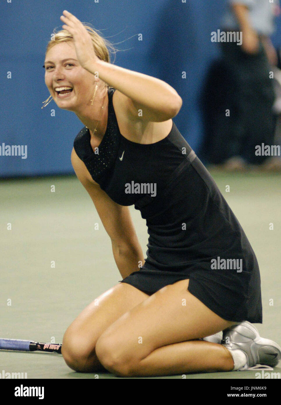 Justine Henin-Hardenne of Belgium seen with trophy after defeating Maria  Sharpova of Russia 7-5, 6-2 in the finals of the Dubai Tennis Championships  in Dubai, United Arab Emirates on February 25, 2006.