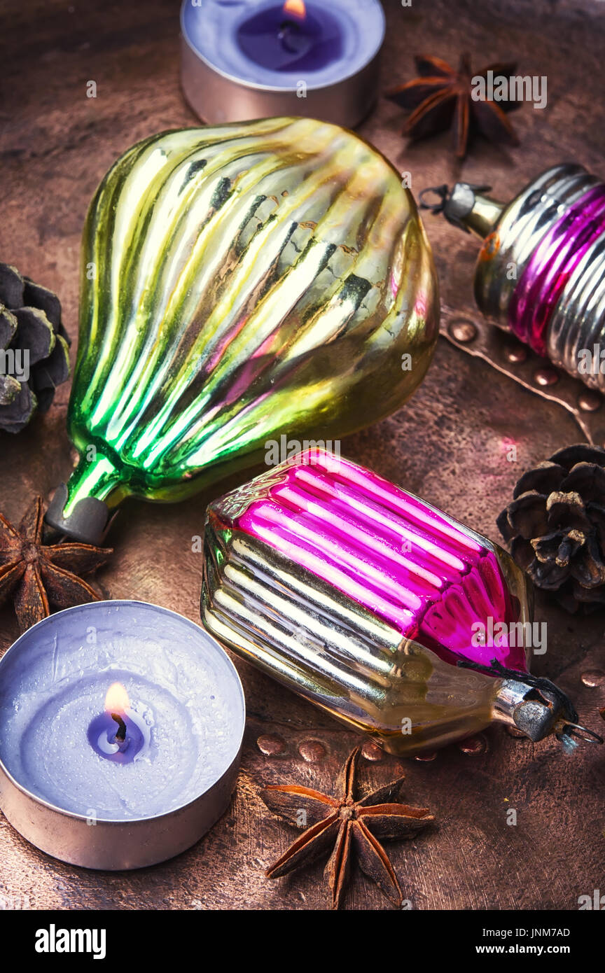 Oldfashioned glass soviet christmas bauble on bronze retro background