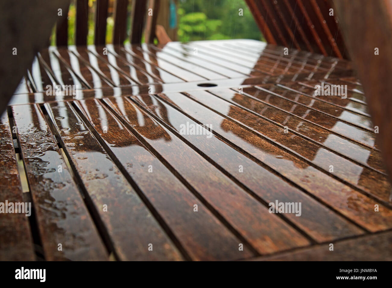Garden furniture during a rainstorm at Cornwall Stock Photo Alamy