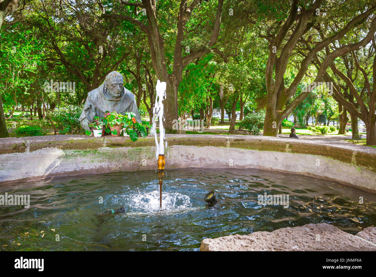 Sassari Sardinia park, fountain and statue of St Francis Of Assisi in the Giardini Pubblici - Public Gardens - in Sassari in northern Sardinia. Stock Photo