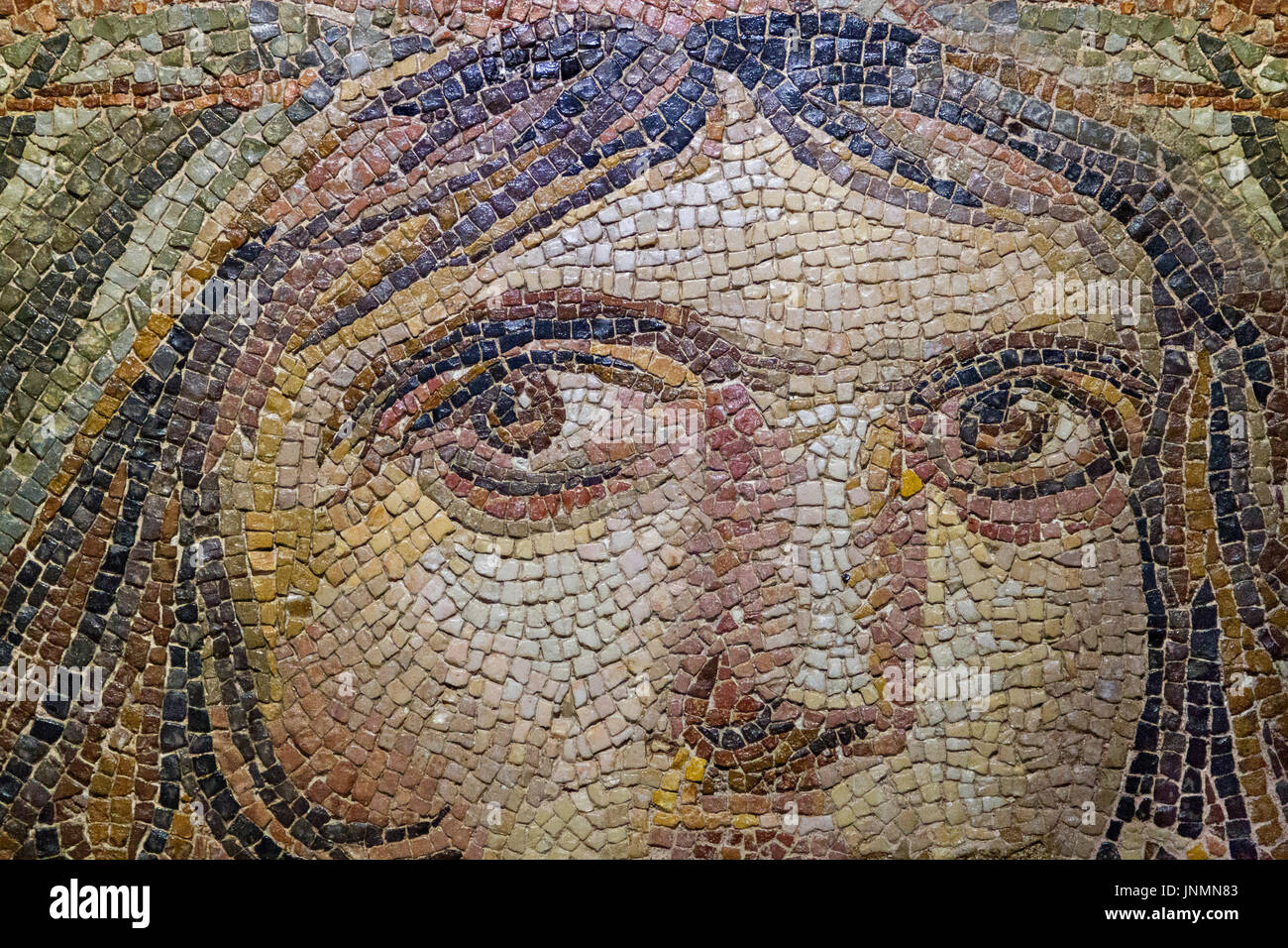 Roman mosaic representing a gypsy girl from the ancient site of Zeugma in Gaziantep, Turkey. Stock Photo