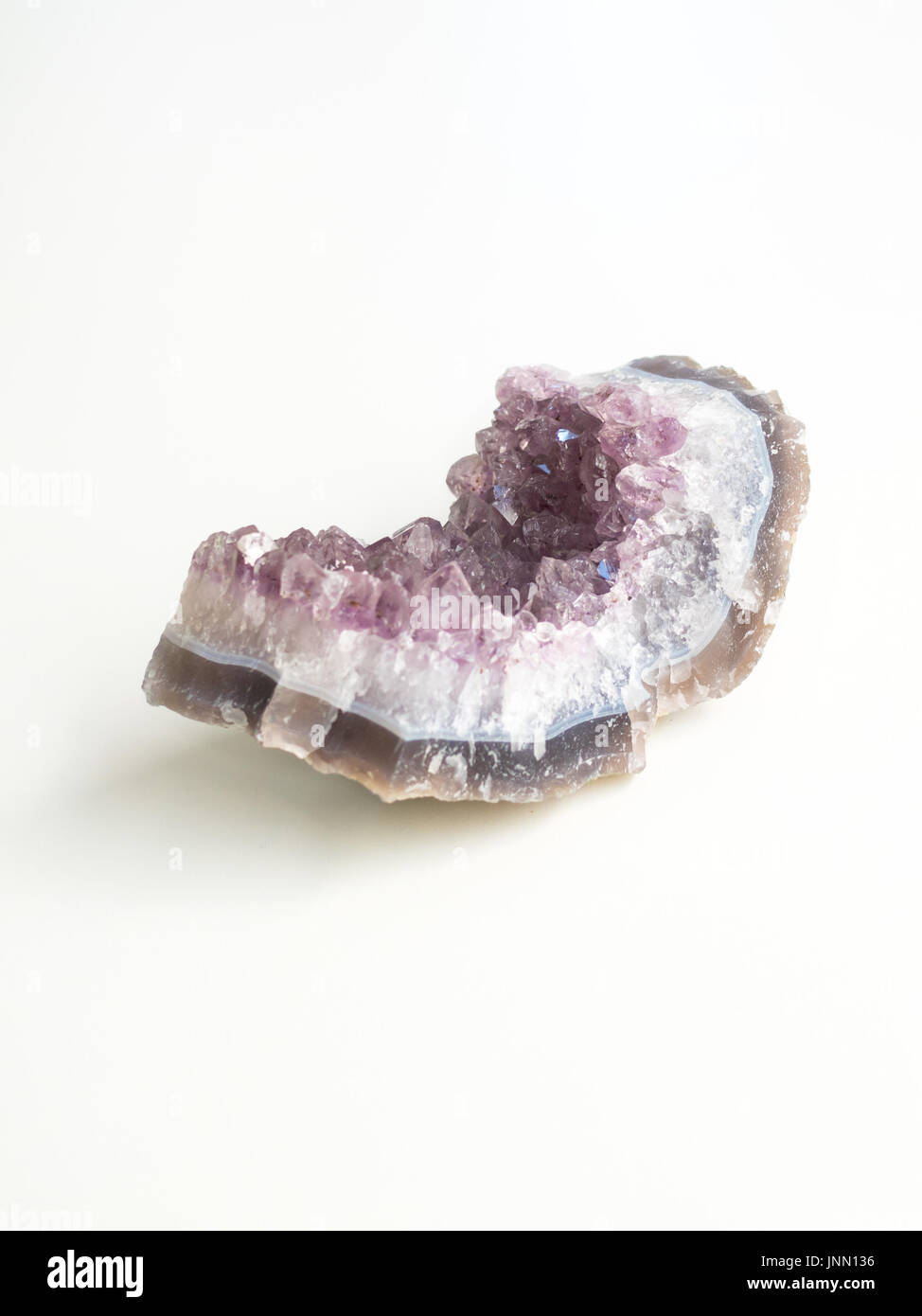Amethyst geode side view for crystal therapy treatments and reiki Stock Photo