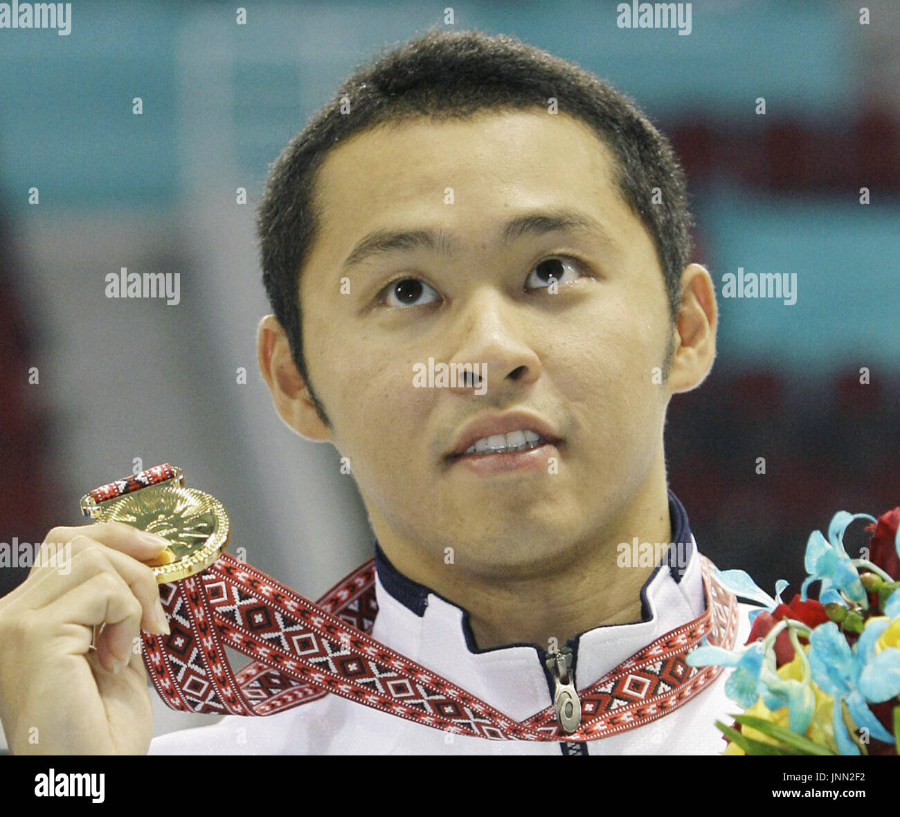 DOHA, Qatar Olympic breaststroke champion Kosuke Kitajima shows off