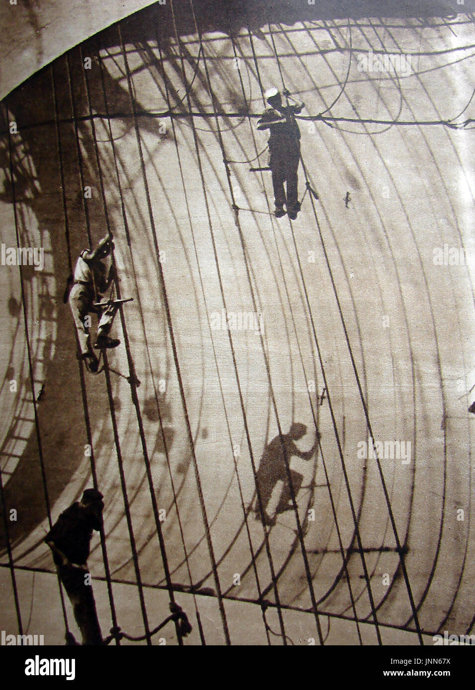 Sailors working in the shrouds and rigging of the  Finnish grain ship 'Parma' in 1934 during the 'Great Grain Race' Stock Photo
