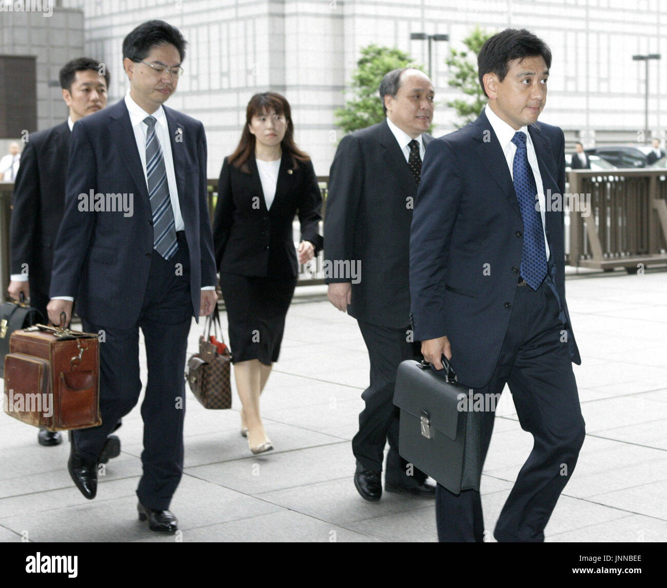 TOKYO, Japan - Former investment fund manager Yoshiaki Murakami (far 