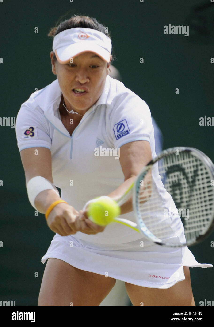 WIMBLEDON, Britain - Thailand's Tamarine Tanasugarn returns the ball to Serbia's Jelena Jankovic during their fourth-round match at the Wimbledon tennis championships at All England Court in London June 30. Second seed Jankovic was defeated 6-3, 6-2. (Kyodo) Stock Photo