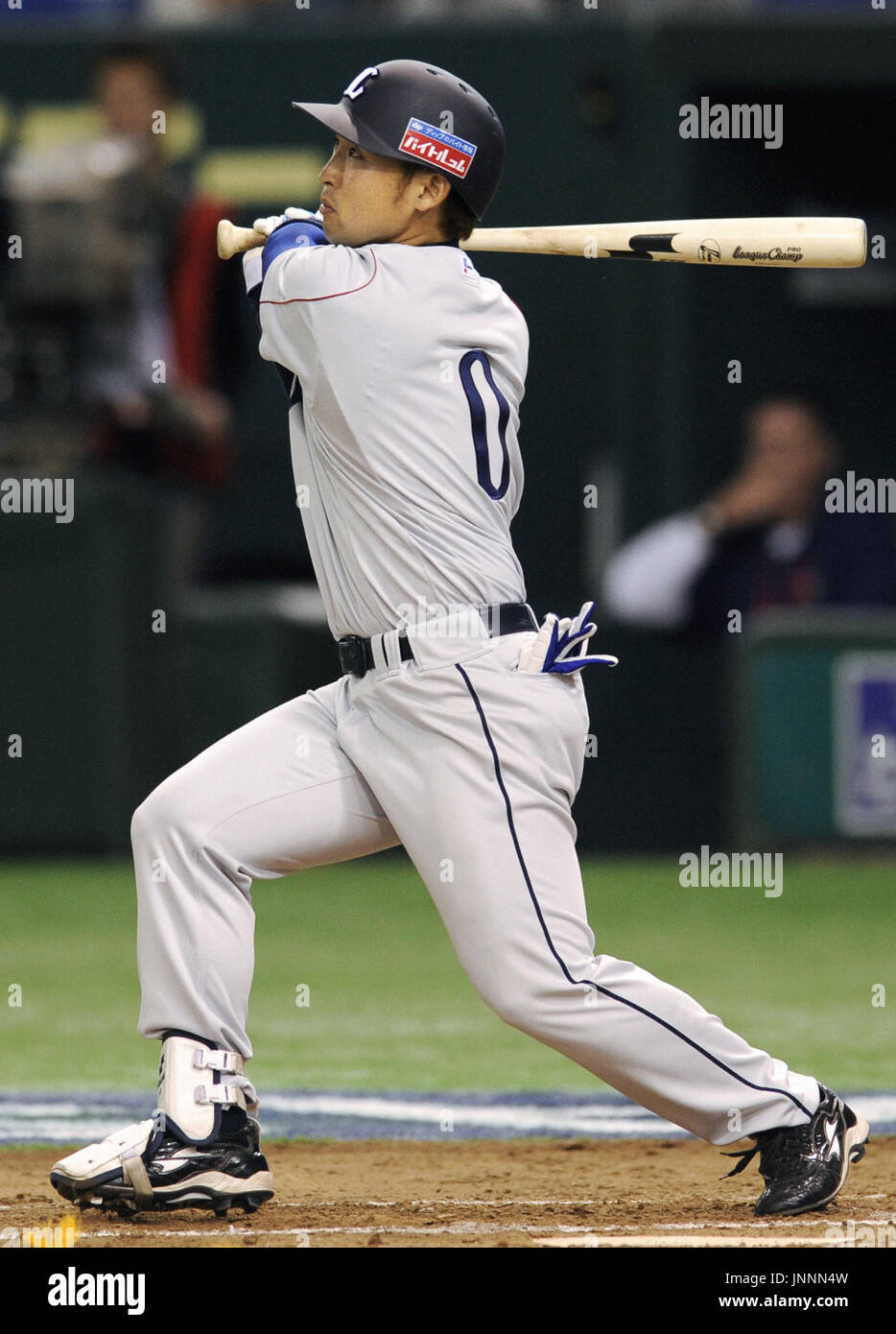 TOKYO, Japan - Outfielder Yutaro Osaki of Japan's Pacific League baseball  club Seibu Lions hits an RBI double in the third inning of an exhibition  game against South Korea at Tokyo Dome
