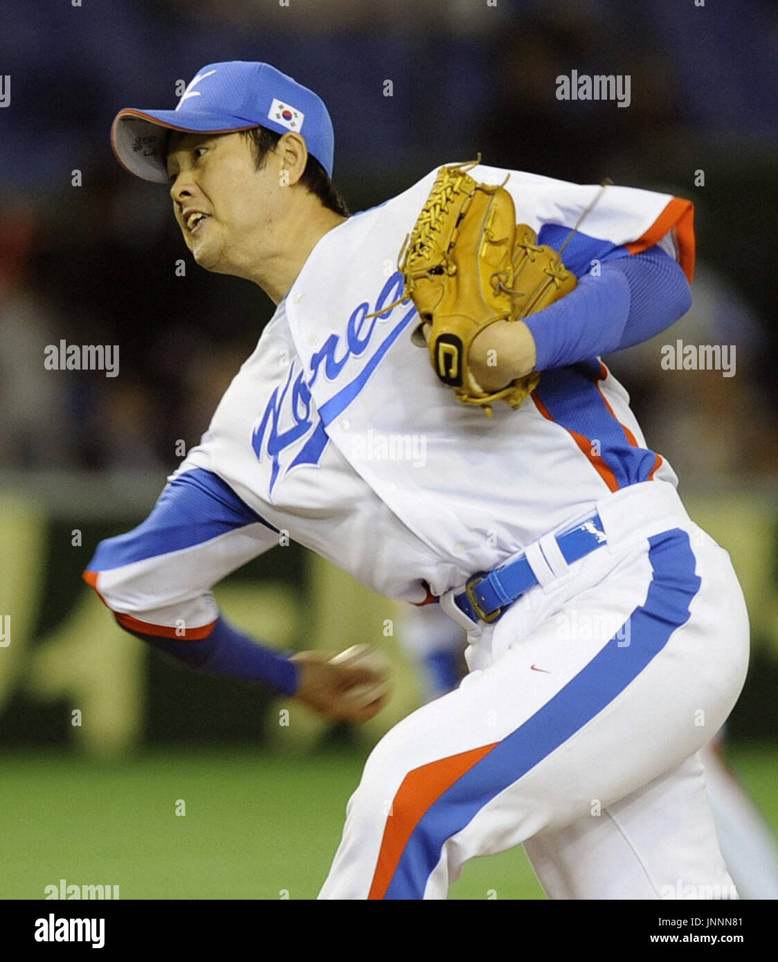 TOKYO, Japan - Chong Tae Hyon of the South Korean national team for the  World Baseball Classic pitches in a warm-up game with Japanese club Yomiuri  Giants at Tokyo Dome on March