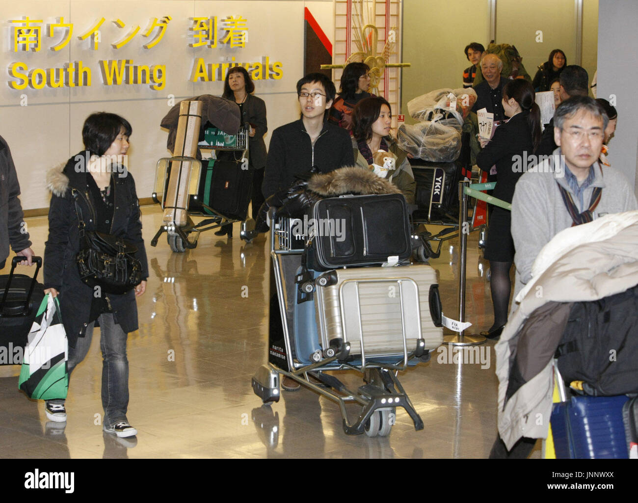 NARITA, Japan - Throngs of holidaymakers crowded the arrival lobbies of ...