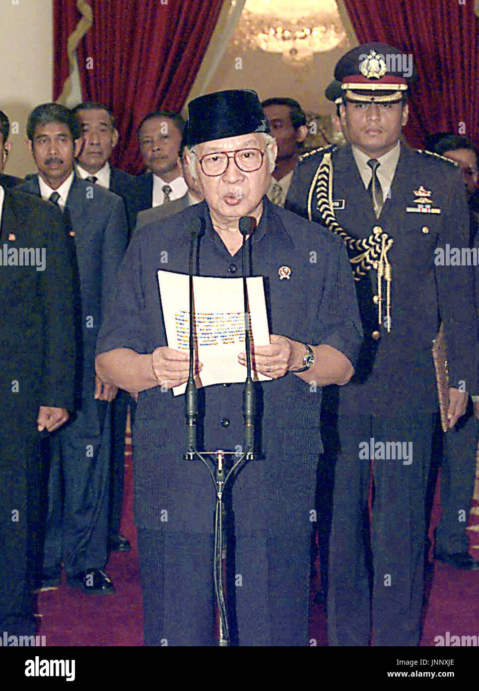 JAKARTA, Indonesia - Indonesian President Suharto expresses his intention to resign at the Merdeka Palace in Jakarta in a photo taken in May 1998. Suharto, who shaped and ruled the country for 32 years through ruthless but quiet authoritarianism, died on Jan. 27 at age 86. (Kyodo) Stock Photo