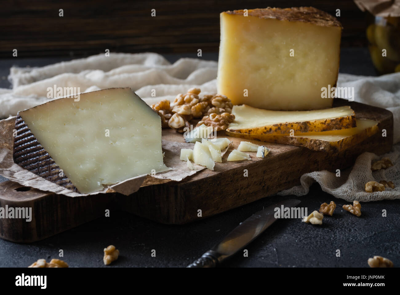 Cheese platter of chopped Spanish hard cheese manchego and sliced