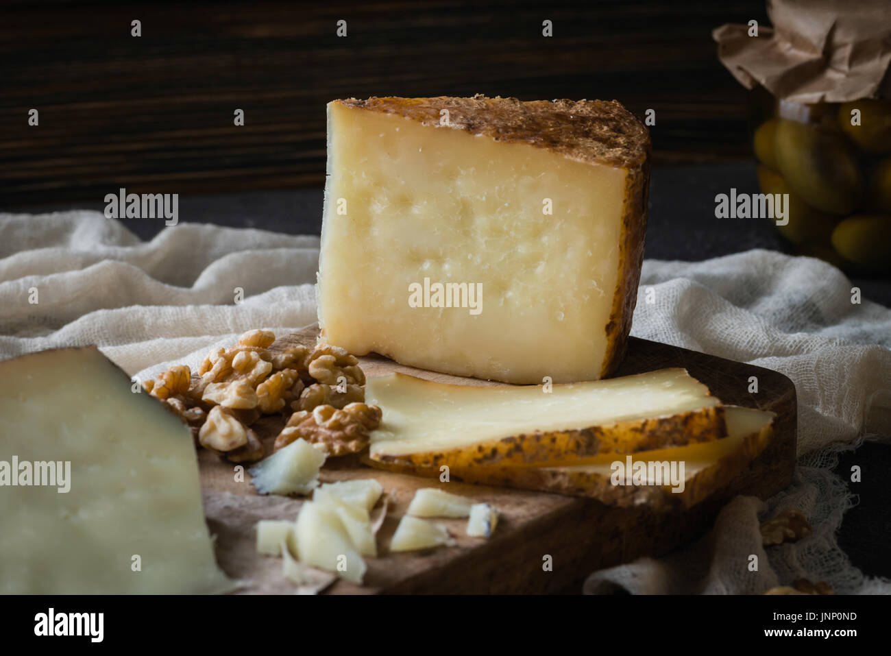 Cheese platter of chopped Spanish hard cheese manchego and sliced Italian pecorino toscano) on