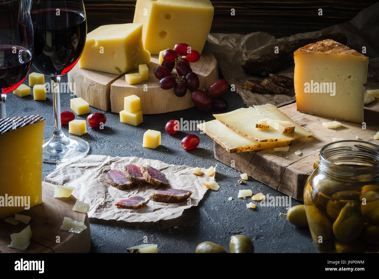 Cheese platter of chopped hard cheeses (Swedish, Spanish manchego) and