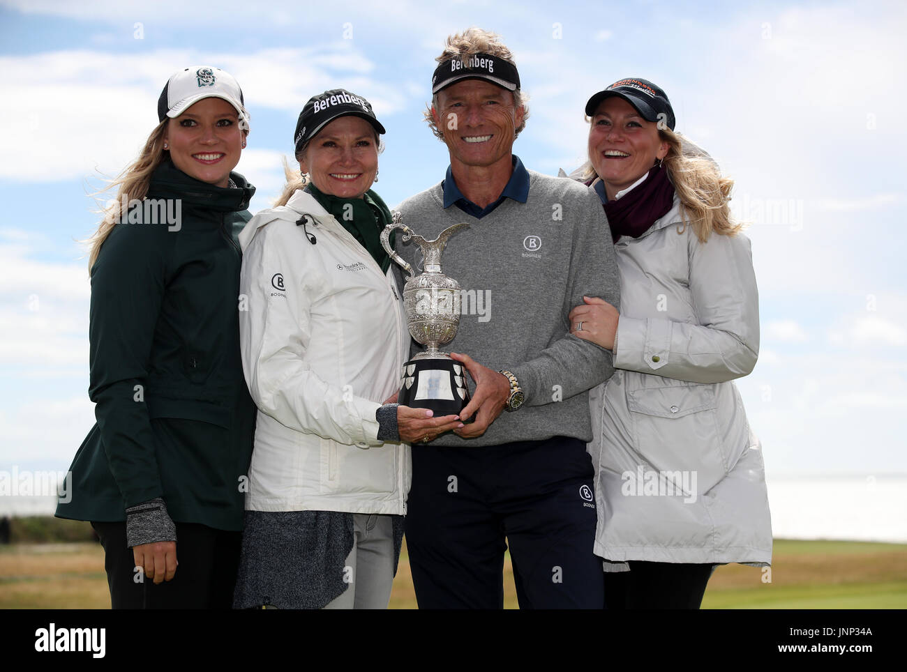 Germany's Bernhard Langer poses with the trophy alongside wife Vikki Carol  and daughters Christina Langer and Jackie Langer after winning the Senior  Open at Royal Porthcawl Golf Club, Porthcawl Stock Photo -