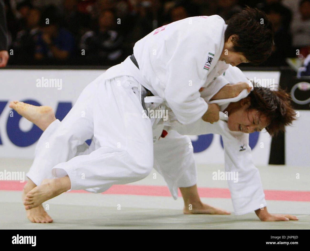 TOKYO, Japan - Yoshie Ueno (L) topples Athens Olympic champion Ayumi  Tanimoto with an ''osotogari'' outer-leg sweep in the all-Japanese 63-kg  final of the Kano Cup international judo tournament at Tokyo Metropolitan